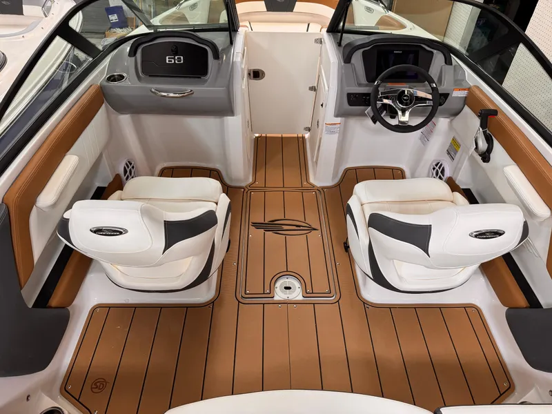 Slide: The Image of 2025 Chaparral 21 SSi OB boat interior with modern seating and dashboard design. - 13