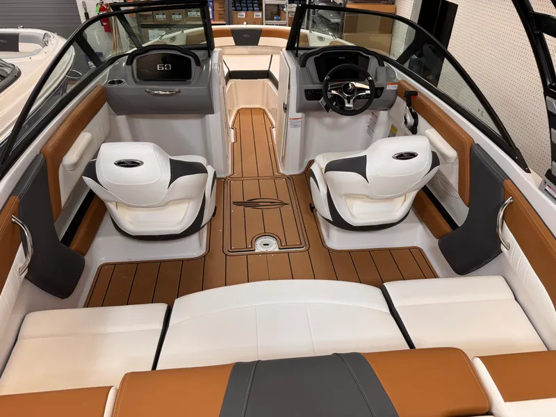 Slide: The Image of 2025 Chaparral 21 SSi OB boat interior with modern seating and sleek design. - 14
