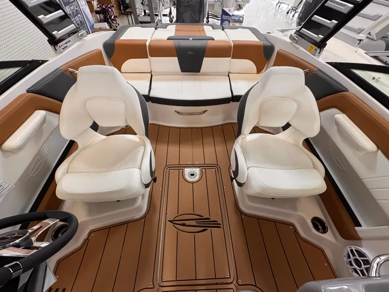 Slide: The Image of 2025 Chaparral 21 SSi OB boat interior with white seats and brown flooring. - 20