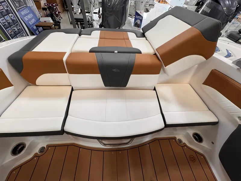 Slide: The Image of 2025 Chaparral 21 SSi OB boat interior with stylish brown and white seating. - 7