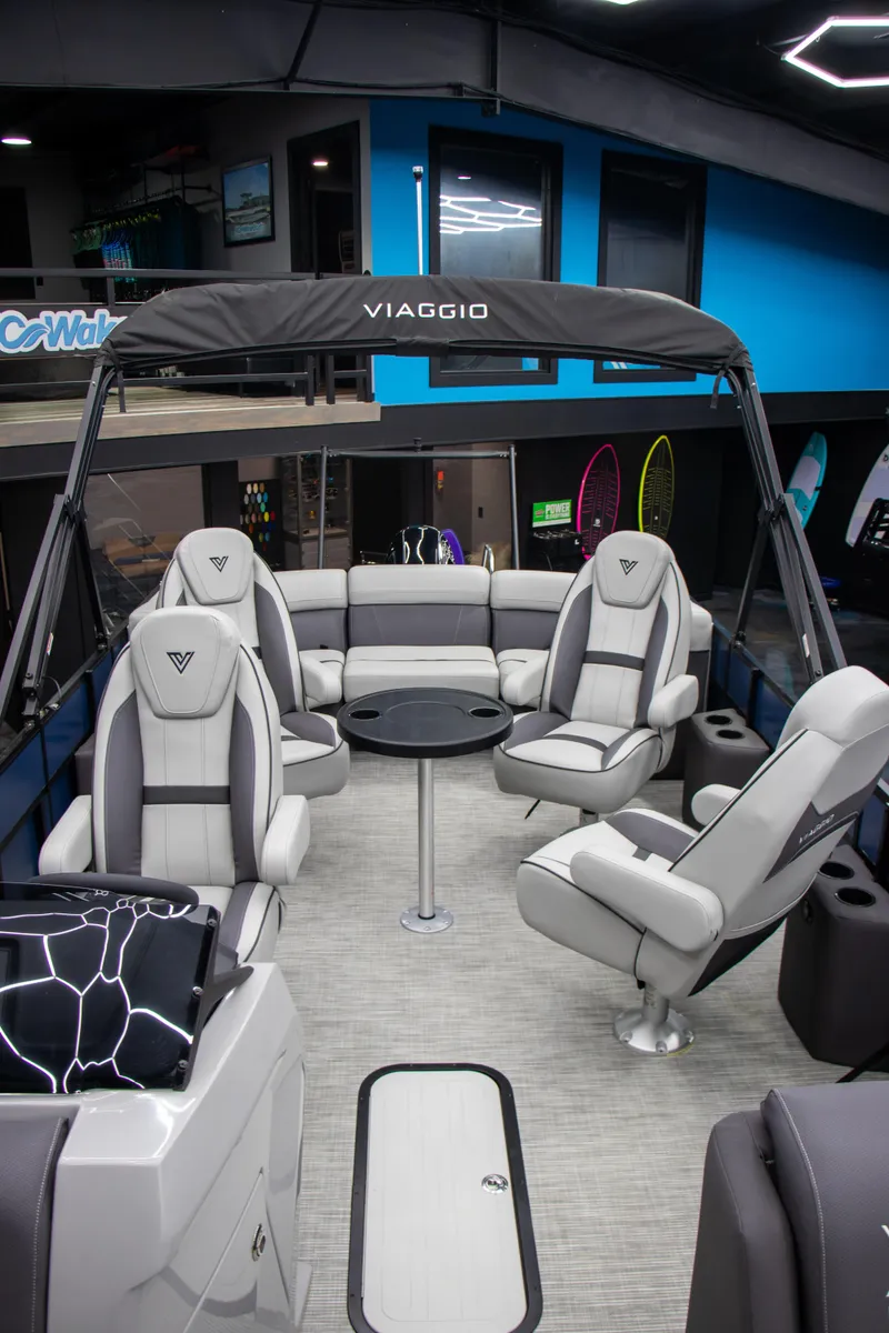 Slide: The Image of 2025 Viaggio Lago X-Q boat interior with modern seating and sleek design. - 17