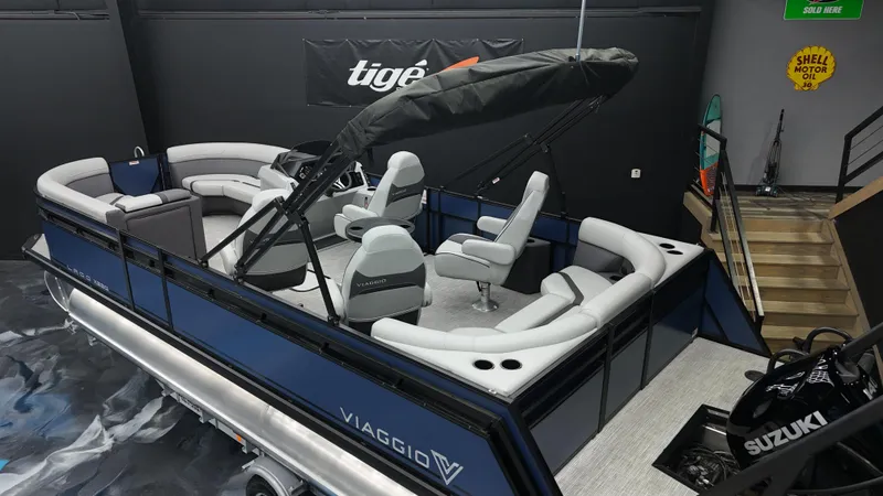 Slide: The Image of 2025 Viaggio Lago X-Q pontoon boat with modern seating and Suzuki engine. - 2