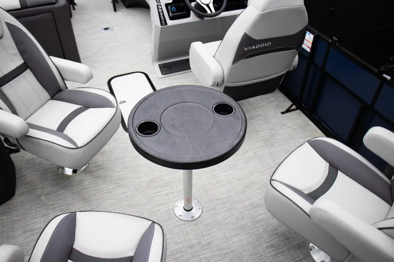 Slide: The Image of Luxurious 2025 Viaggio Lago X-Q boat interior with stylish seating and a central table. - 21