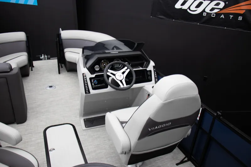 Slide: The Image of Interior of 2025 Viaggio Lago X-Q boat with modern steering and seating. - 22