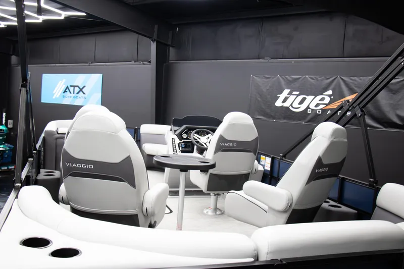 Slide: The Image of 2025 Viaggio Lago X-Q boat interior with modern seating and steering console. - 8