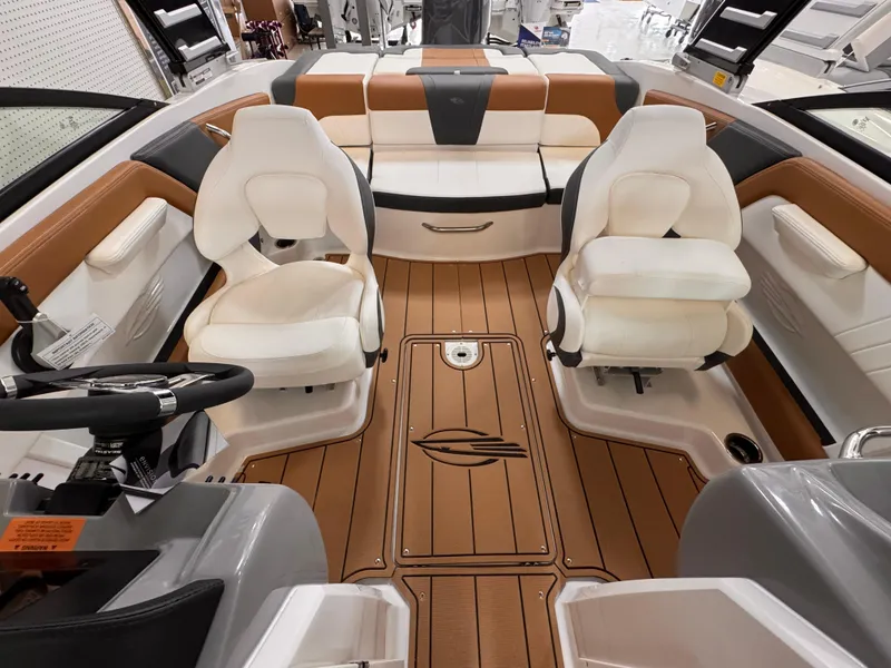 Slide: The Image of 2025 Chaparral 21 SSi OB boat interior with modern seating and wood-style flooring. - 16