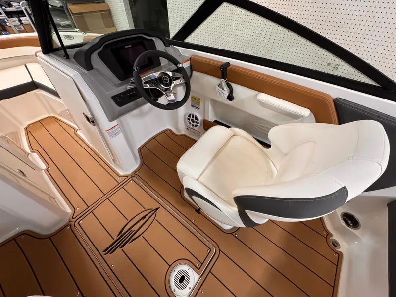 Slide: The Image of 2025 Chaparral 21 SSi OB boat interior with modern helm and comfortable seating. - 19