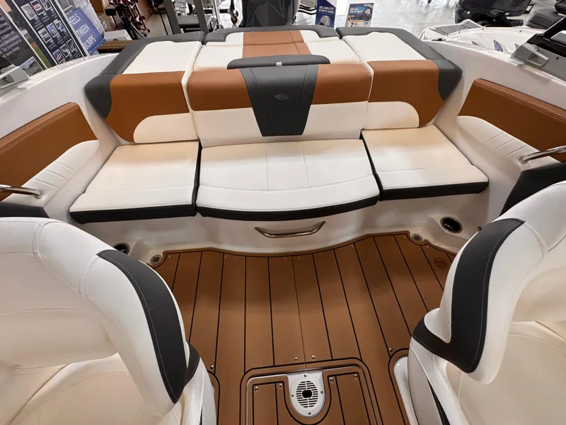 Slide: The Image of 2025 Chaparral 21 SSi OB boat interior with stylish seating and teak flooring. - 2