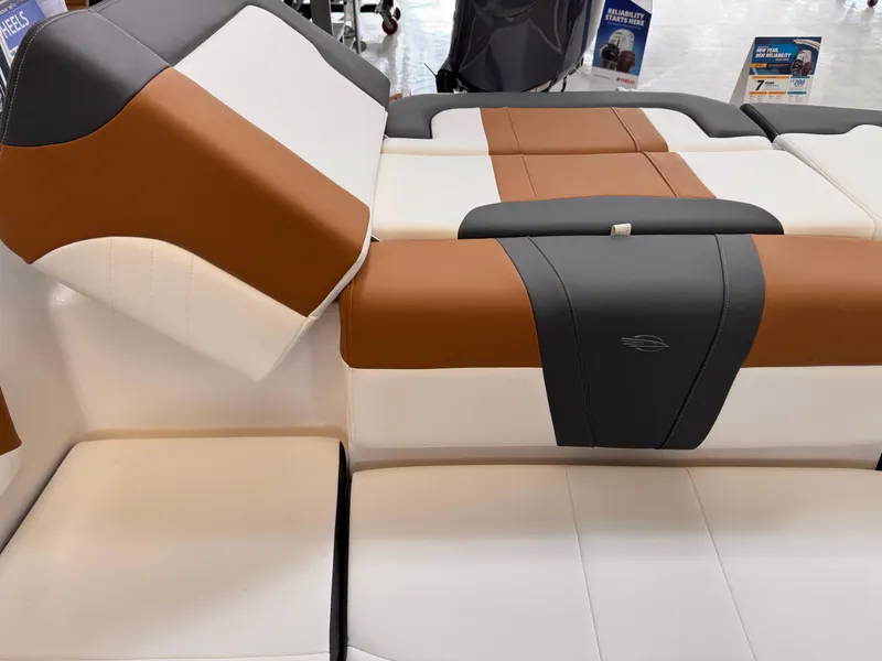 Slide: The Image of 2025 Chaparral 21 SSi OB boat interior with brown, gray, and white seating. - 5