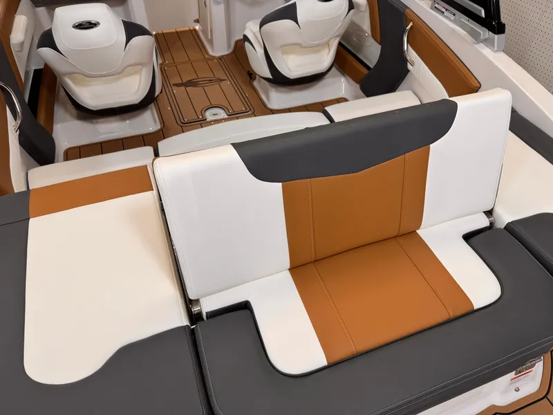 Slide: The Image of 2025 Chaparral 21 SSi OB boat interior with stylish brown and white seating. - 7