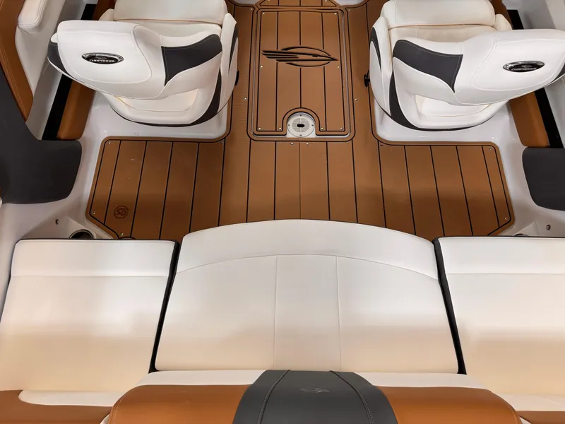 Slide: The Image of 2025 Chaparral 21 SSi OB boat interior with white seats and brown flooring. - 9