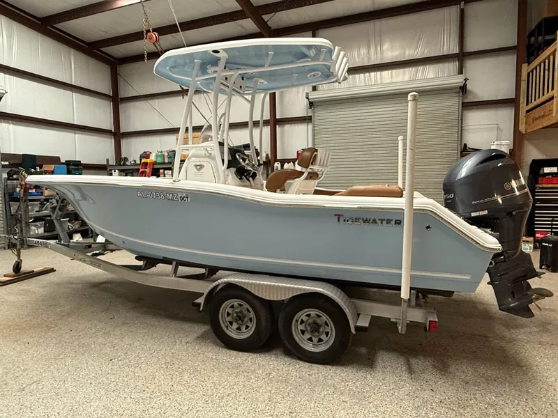 Slide: The Image of 2017 Tidewater 210 LXF boat on trailer in a garage setting. - 0