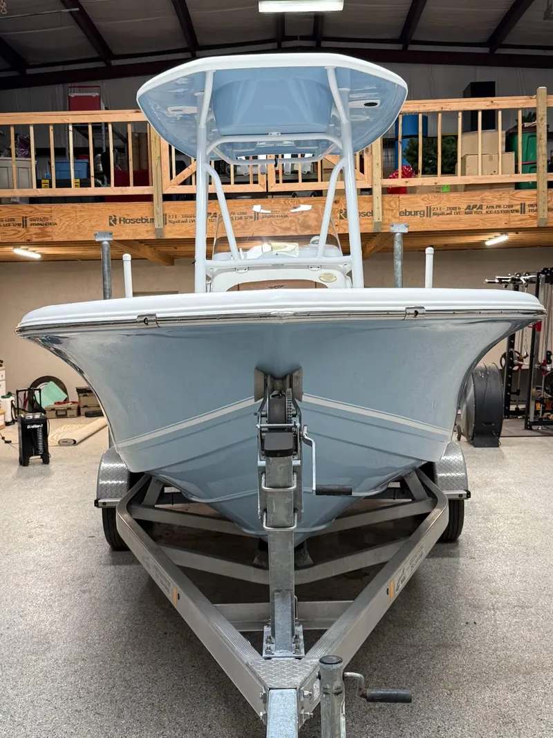 Slide: The Image of 2017 Tidewater 210 LXF boat on trailer in garage setting. - 1