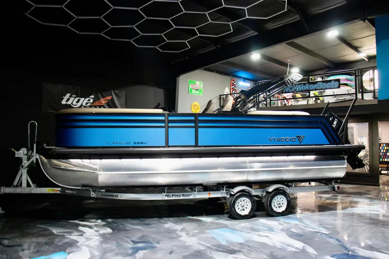 Slide: The Image of 2025 Viaggio Lago Z-U pontoon boat on trailer in showroom. - 15