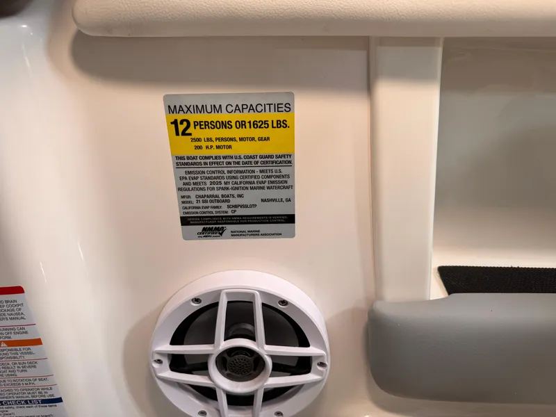 Slide: The Image of 2025 Chaparral 21 SSi OB boat capacity label, 12 persons or 1625 lbs, with speaker detail. - 15