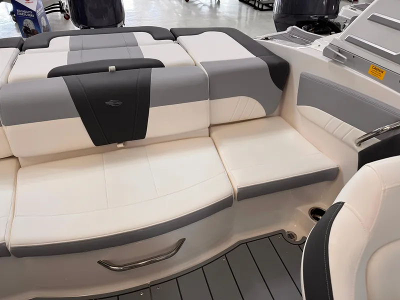 Slide: The Image of 2025 Chaparral 21 SSi OB boat interior with gray and white seating. - 21