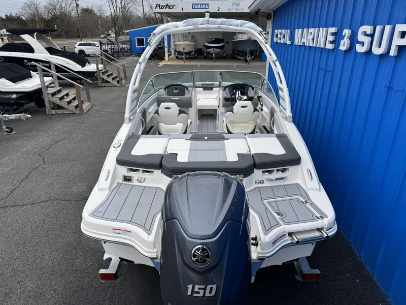 Slide: The Image of 2025 Chaparral 21 SSi OB boat with Yamaha 150 engine at marine dealership. - 5