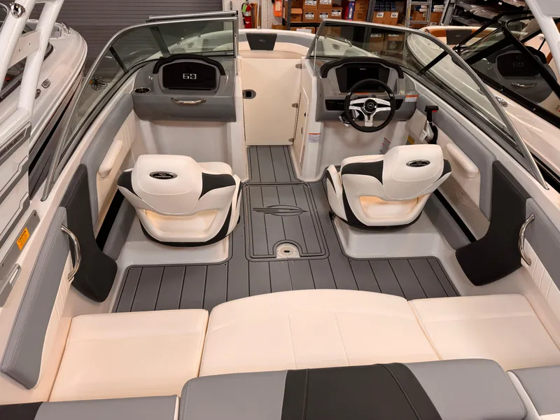 Slide: The Image of 2025 Chaparral 21 SSi OB boat interior with modern seating and steering console. - 6