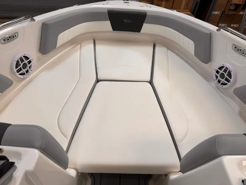 Slide: The Image of 2025 Chaparral 21 SSi OB boat interior with white and gray seating. - 9