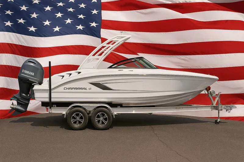 The Image of 2025 Chaparral 21 SSi OB boat on trailer, American flag background. - 0