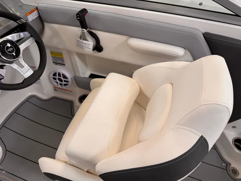 Slide: The Image of Interior of 2025 Chaparral 21 SSi OB boat with steering wheel and cushioned seat. - 13