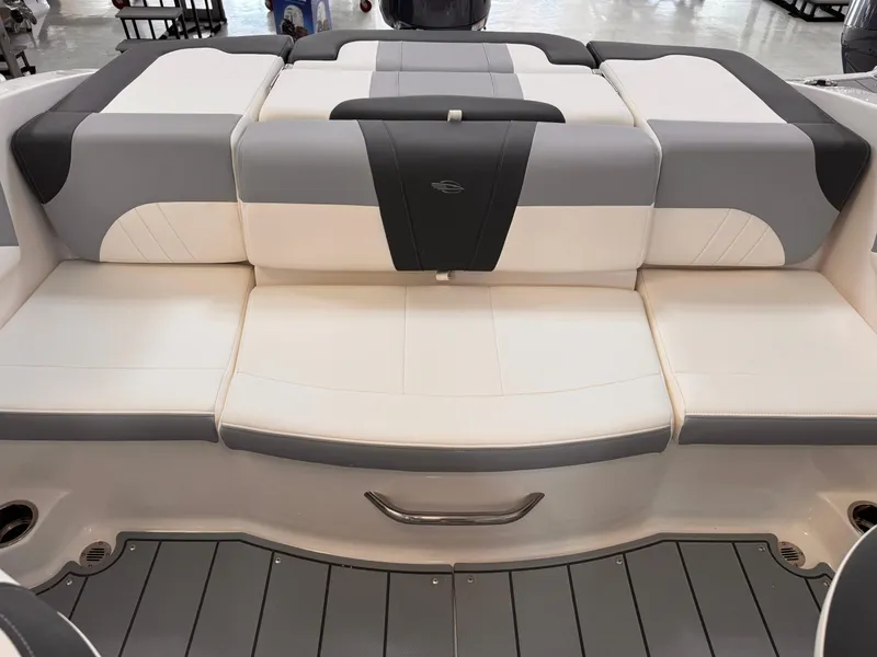 Slide: The Image of 2025 Chaparral 21 SSi OB boat interior with cushioned seating and sleek design. - 16