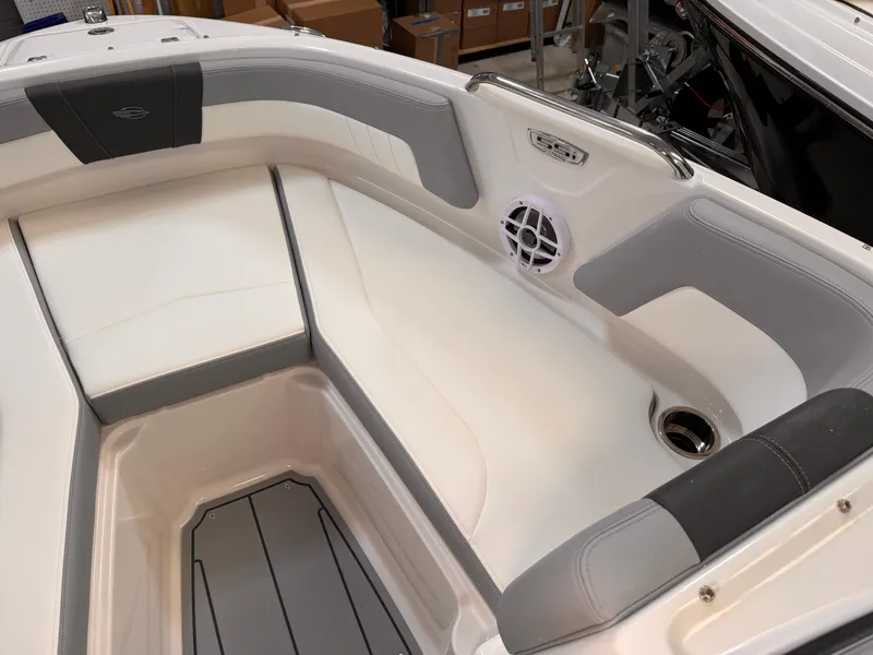 Slide: The Image of 2025 Chaparral 21 SSi OB boat interior with white and gray seating. - 3