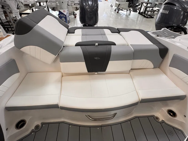 Slide: The Image of 2025 Chaparral 21 SSi OB boat interior with cushioned seating in showroom. - 41