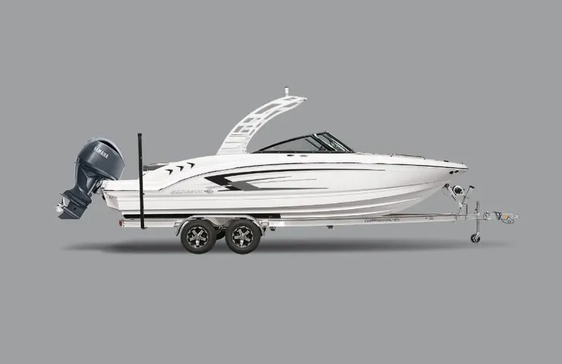 Slide: The Image of 2025 Chaparral 21 SSi OB boat on trailer, side view, gray background. - 43