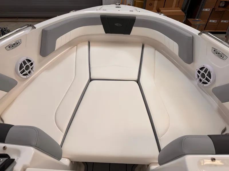Slide: The Image of 2025 Chaparral 21 SSi OB boat interior with white and gray seating. - 8