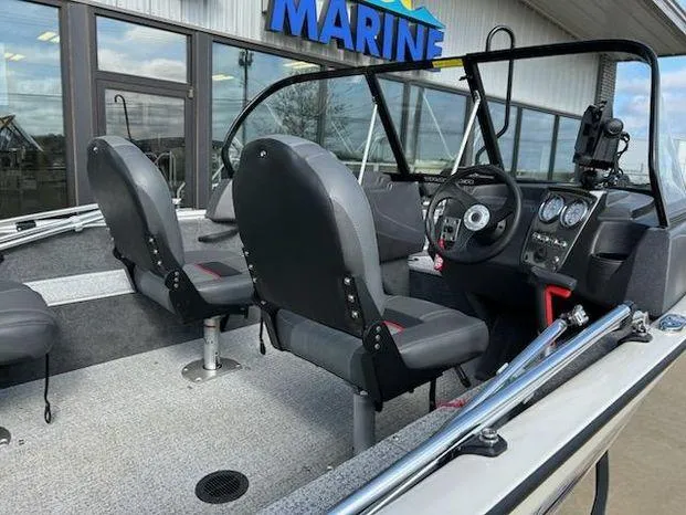 Slide: The Image of 2021 Tracker Pro Guide V-16 WT boat interior with dual seats and dashboard controls. - 8