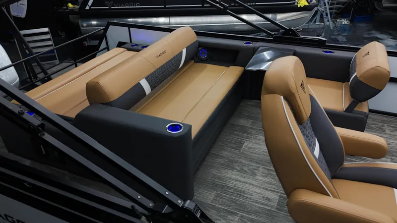 Slide: The Image of 2025 Viaggio Lago Z-S boat interior with tan and gray seating, modern design, and cup holders. - 12