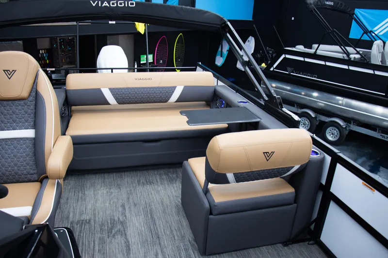 Slide: The Image of Luxurious 2025 Viaggio Lago Z-S boat interior with tan and gray seating. - 24