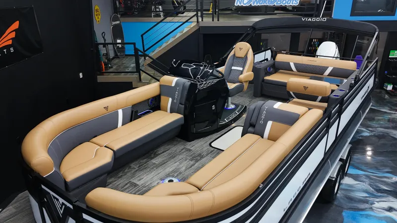 Slide: The Image of 2025 Viaggio Lago Z-S boat interior with luxurious tan and gray seating. - 6