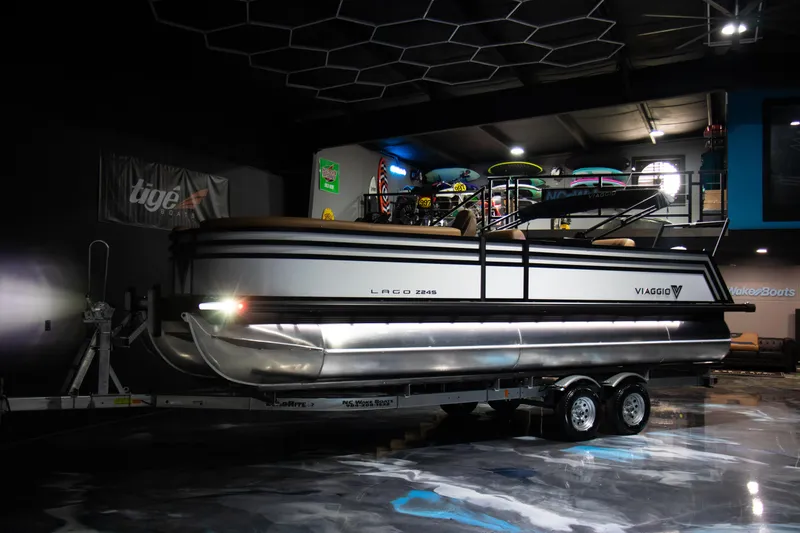 Slide: The Image of 2025 Viaggio Lago Z-S pontoon boat on trailer in showroom. - 8