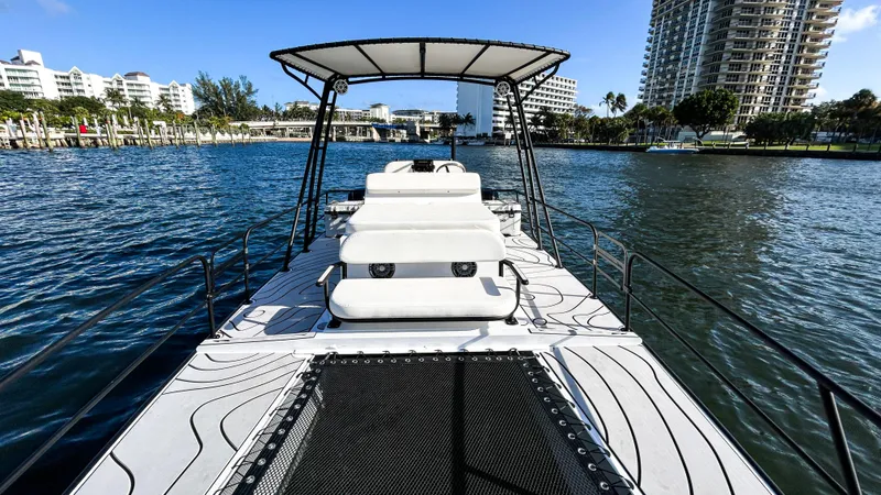 Slide: The Image of 2025 Pontoon Harpoon boat on water, featuring sleek design and spacious deck. - 10