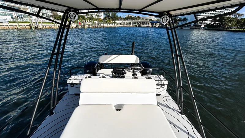 Slide: The Image of 2025 Pontoon Harpoon boat on water, featuring spacious deck and modern design. - 11