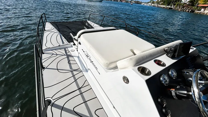 Slide: The Image of 2025 Pontoon Harpoon boat on water, featuring sleek design and modern controls. - 15