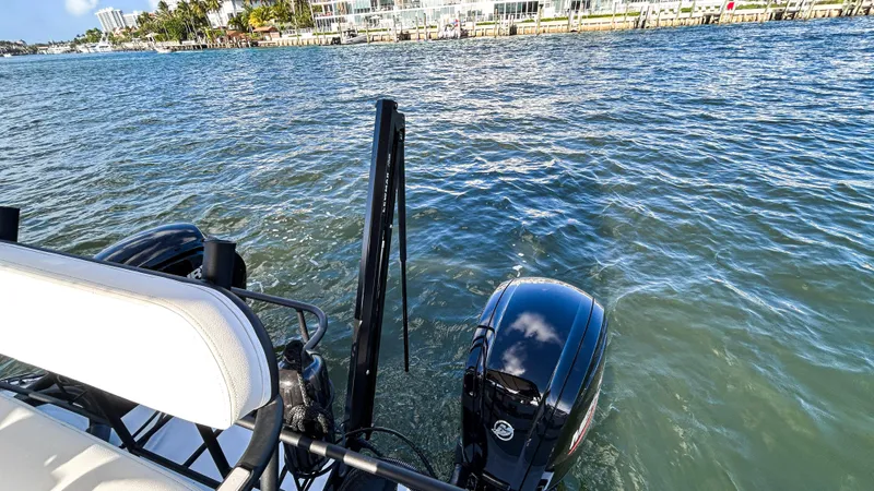 Slide: The Image of 2025 Pontoon Harpoon boat on water, featuring dual outboard motors. - 26