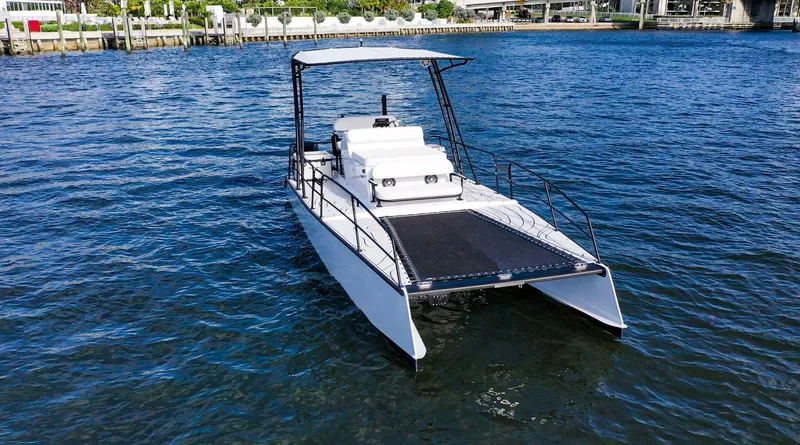 Slide: The Image of 2025 Pontoon Harpoon boat on water, featuring sleek design and spacious deck. - 5