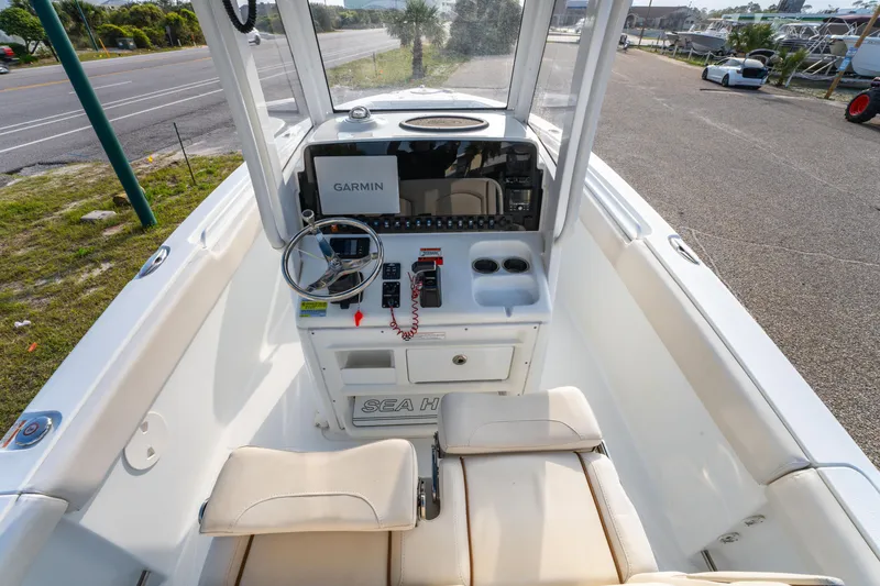 Slide: The Image of 2018 Sea Hunt 255 SE boat cockpit with Garmin navigation system and comfortable seating. - 10