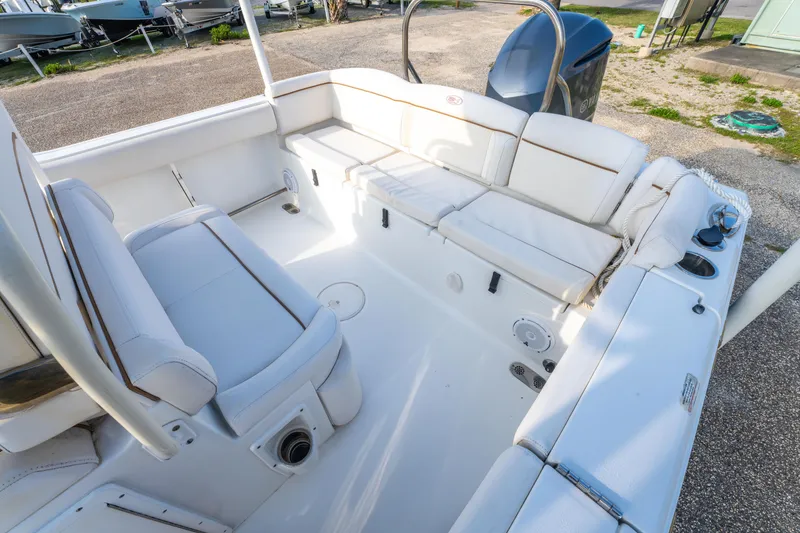 Slide: The Image of 2018 Sea Hunt 255 SE boat interior with white seating and spacious layout. - 14
