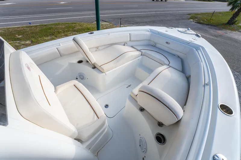 Slide: The Image of 2018 Sea Hunt 255 SE boat interior with white cushioned seating. - 21