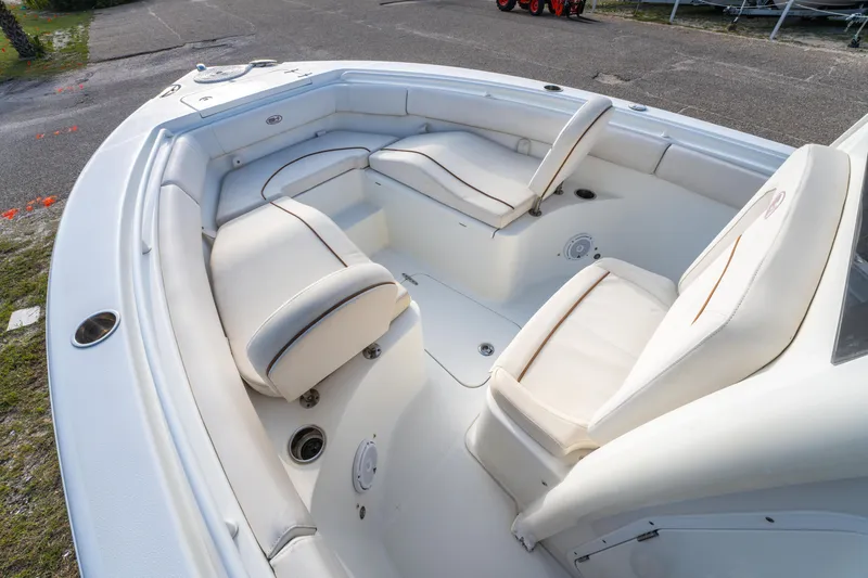 Slide: The Image of 2018 Sea Hunt 255 SE boat interior with white cushioned seating. - 22