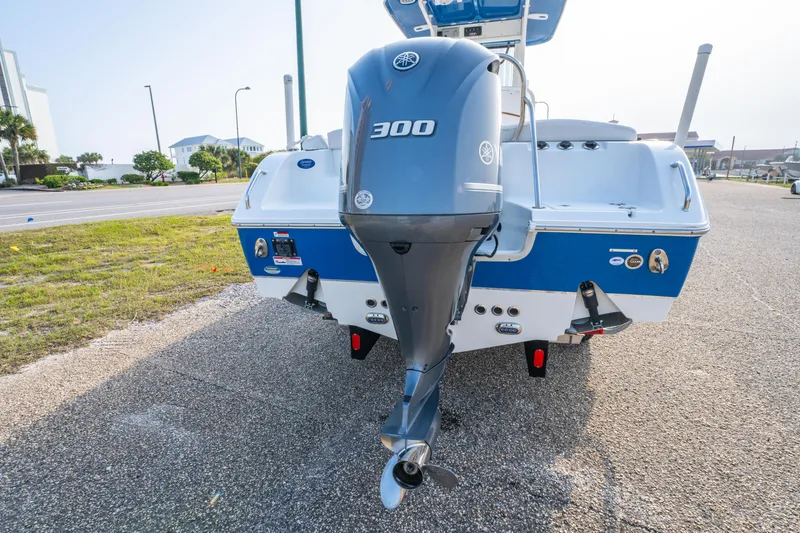 Slide: The Image of 2018 Sea Hunt 255 SE boat with Yamaha 300 engine, parked on pavement. - 7