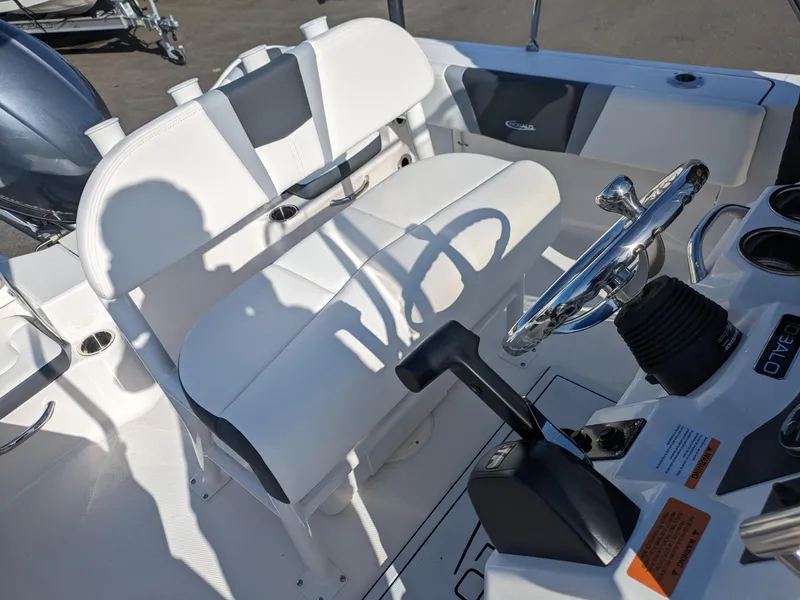 Slide: The Image of 2025 Robalo R180 Center Console boat interior with steering wheel and seating. - 10