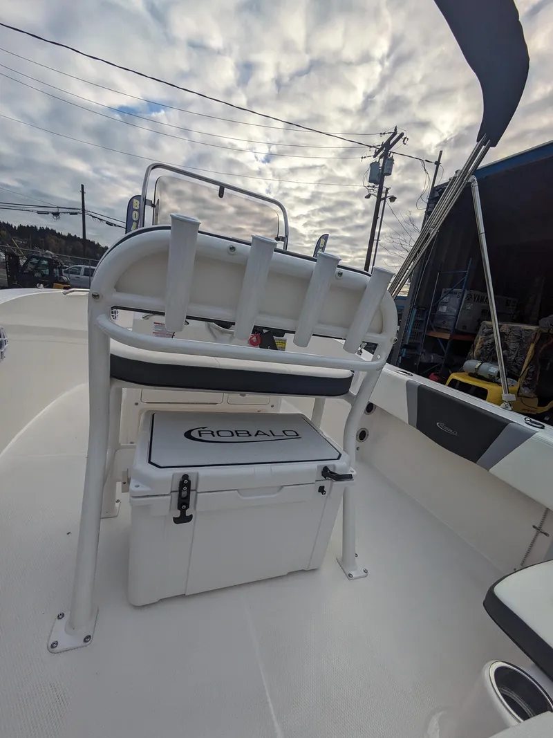 Slide: The Image of 2025 Robalo R180 Center Console boat interior with seating and storage. - 14