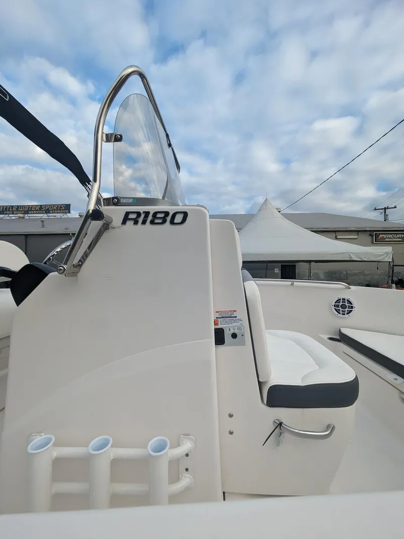 Slide: The Image of 2025 Robalo R180 Center Console boat with sleek design and modern features. - 18