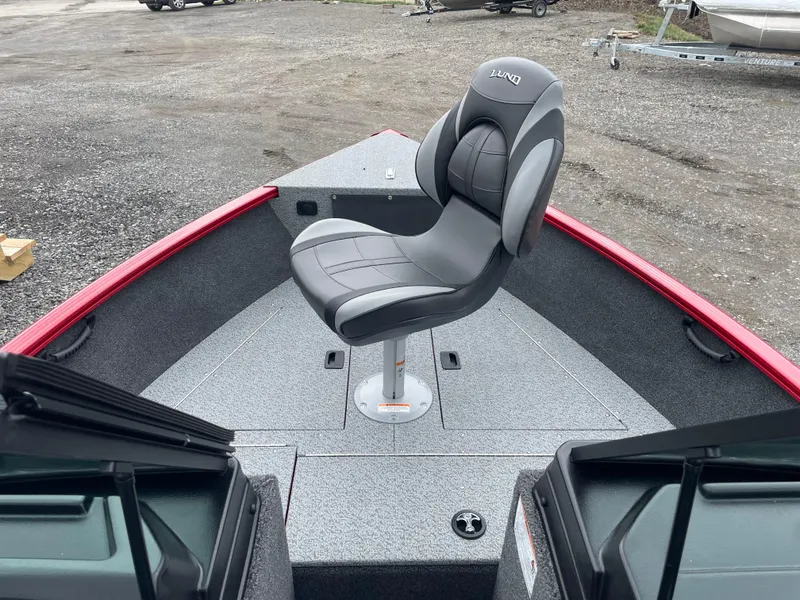 Slide: The Image of 2025 Lund 1650 Rebel XL Sport boat with a sleek, modern seating design. - 24