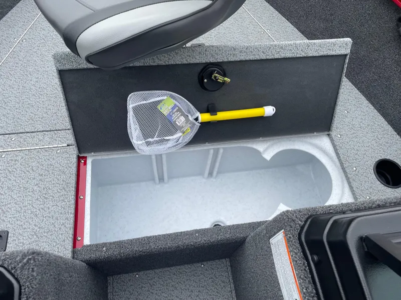 Slide: The Image of 2025 Lund 1650 Rebel XL Sport boat interior with storage compartment and fishing net. - 25